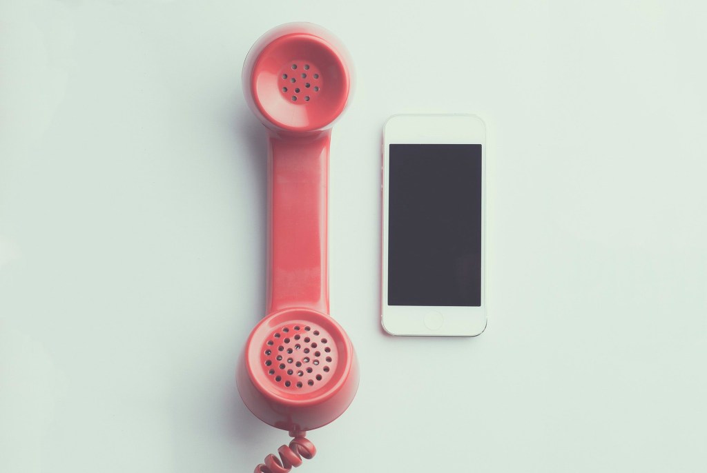 Old Phone juxtaposed next to Iphone