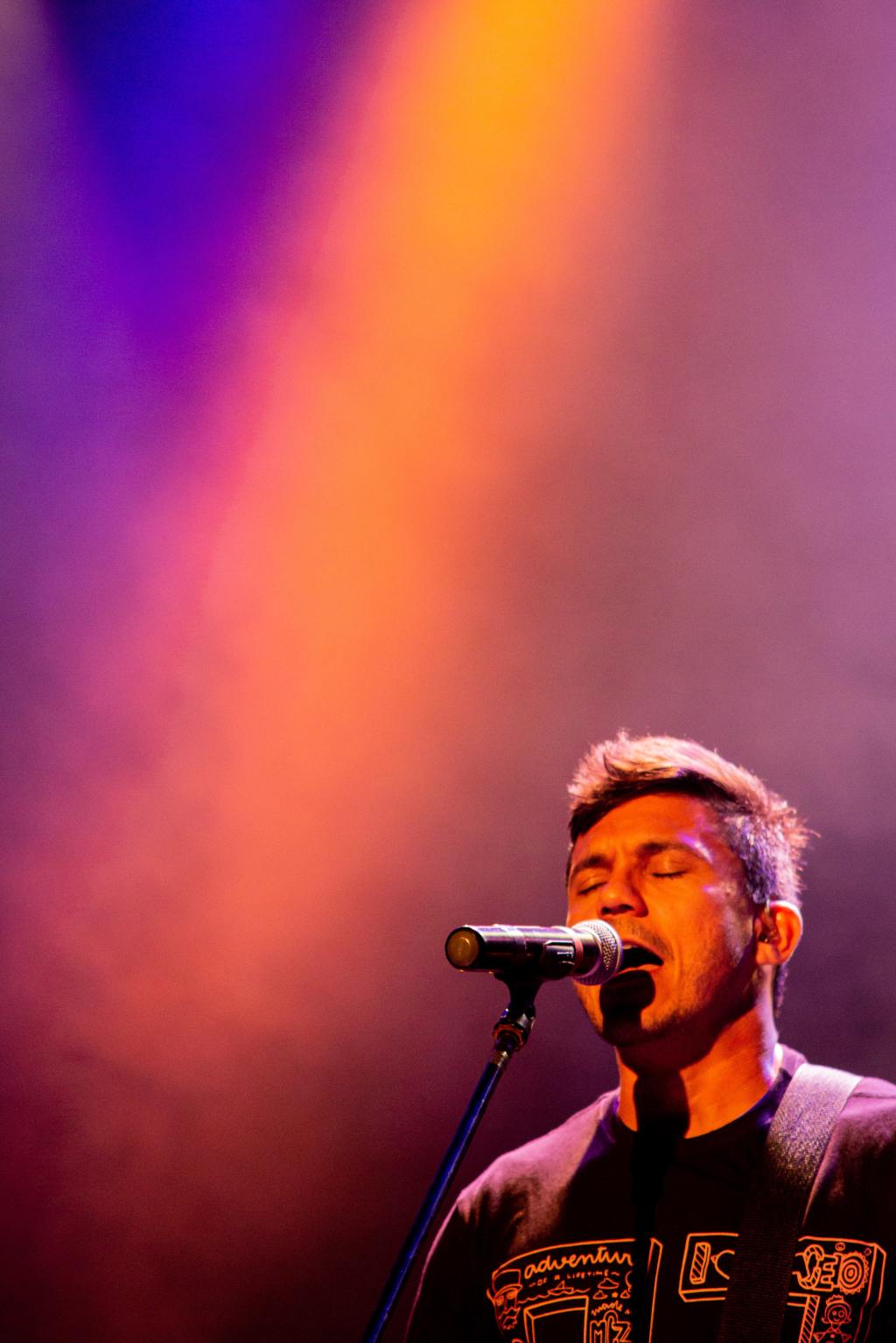 man singing into microphone