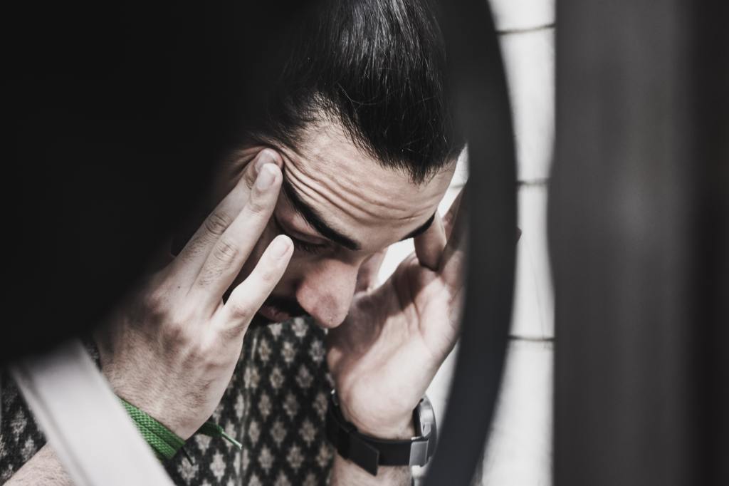 Man holding his temples