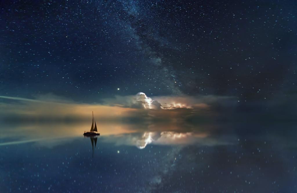 night sky with sailboat