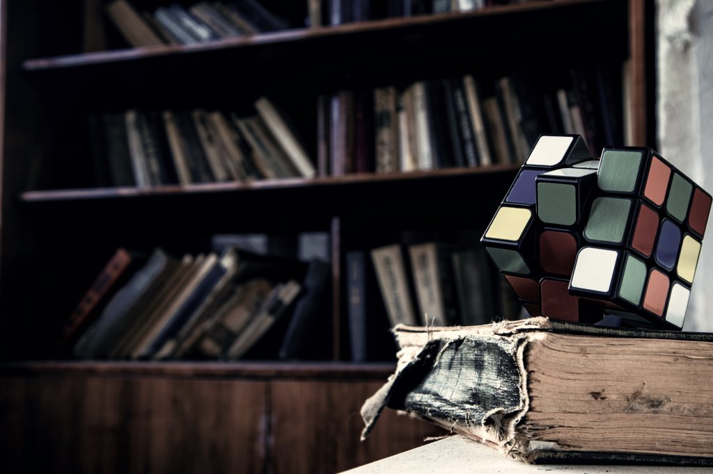 Vintage book with rubik's cube