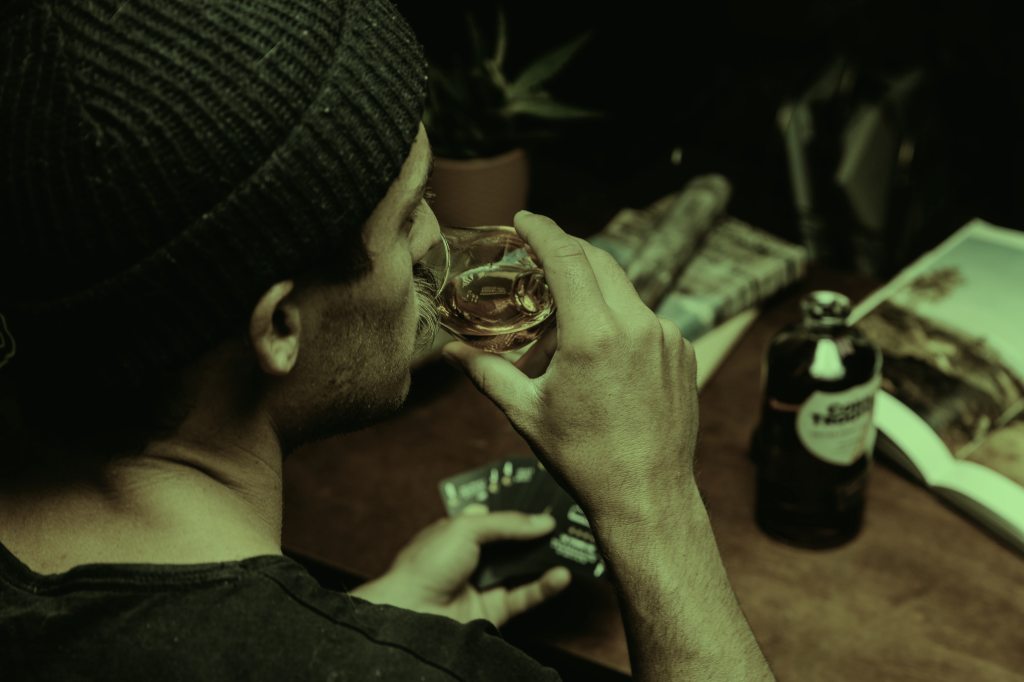 man tasting whiskey
